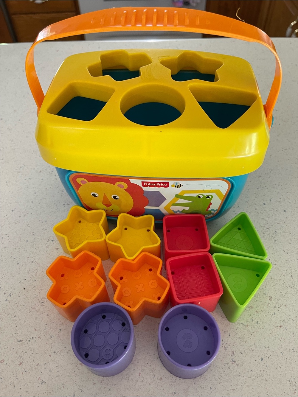 Fisher-Price Colorful Shape Sorting Bucket with handle and 10 different shapes!